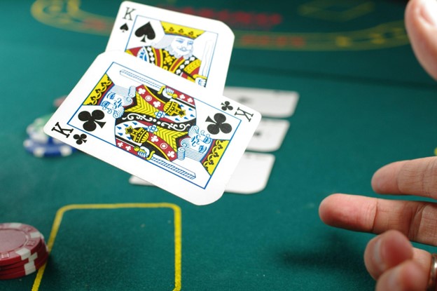 Poker Player showing pocket kings at the casino table